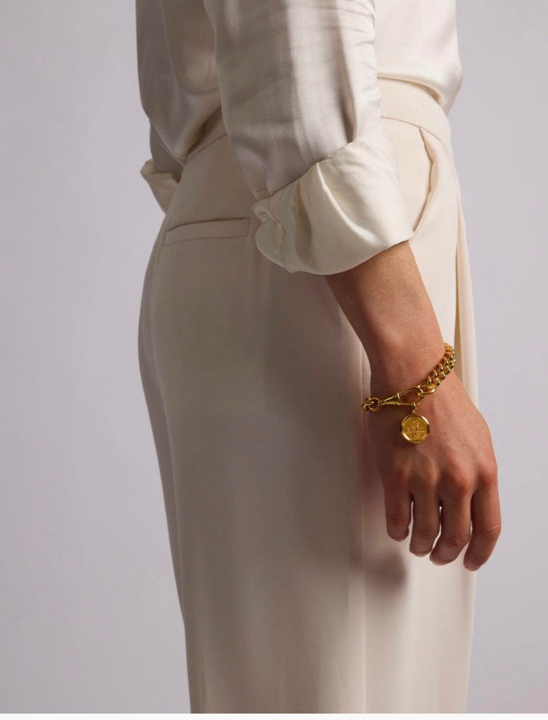 Large gold Moi & Toi disc on large clip bracelet