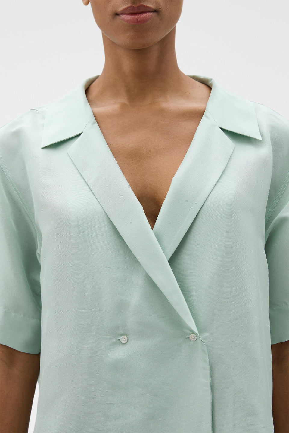 Wrap silk shirt in glass