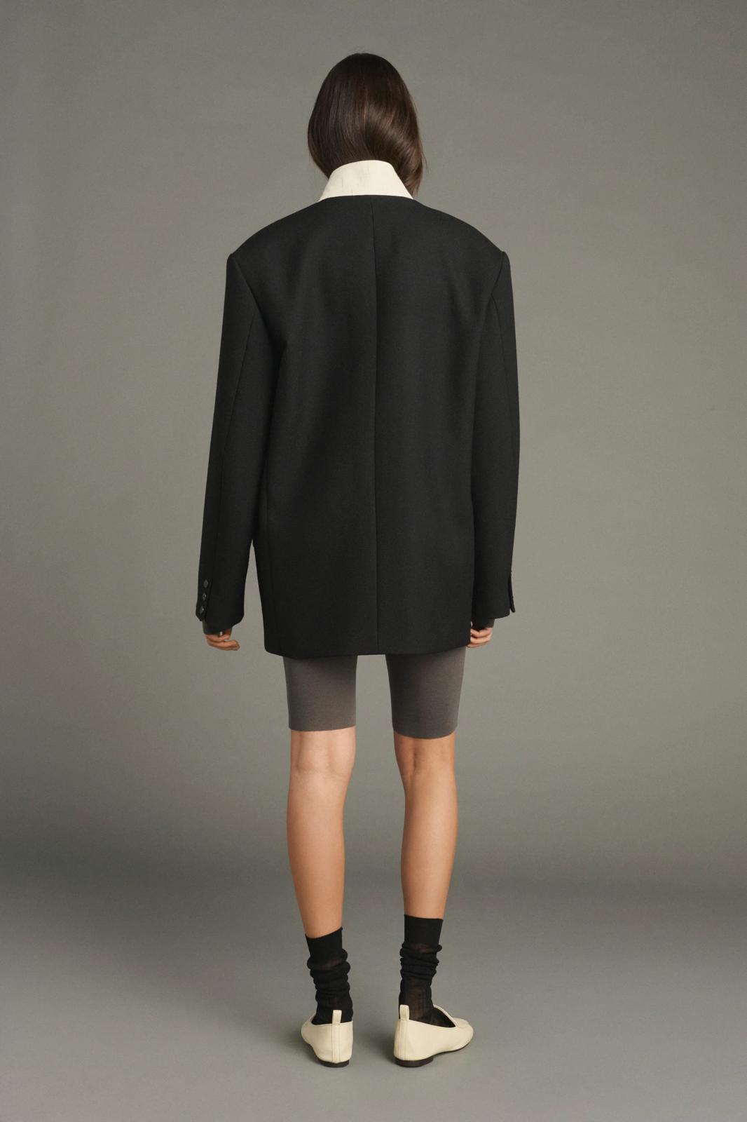 Lars coat                                   Oversized beige jacket with turned down collar