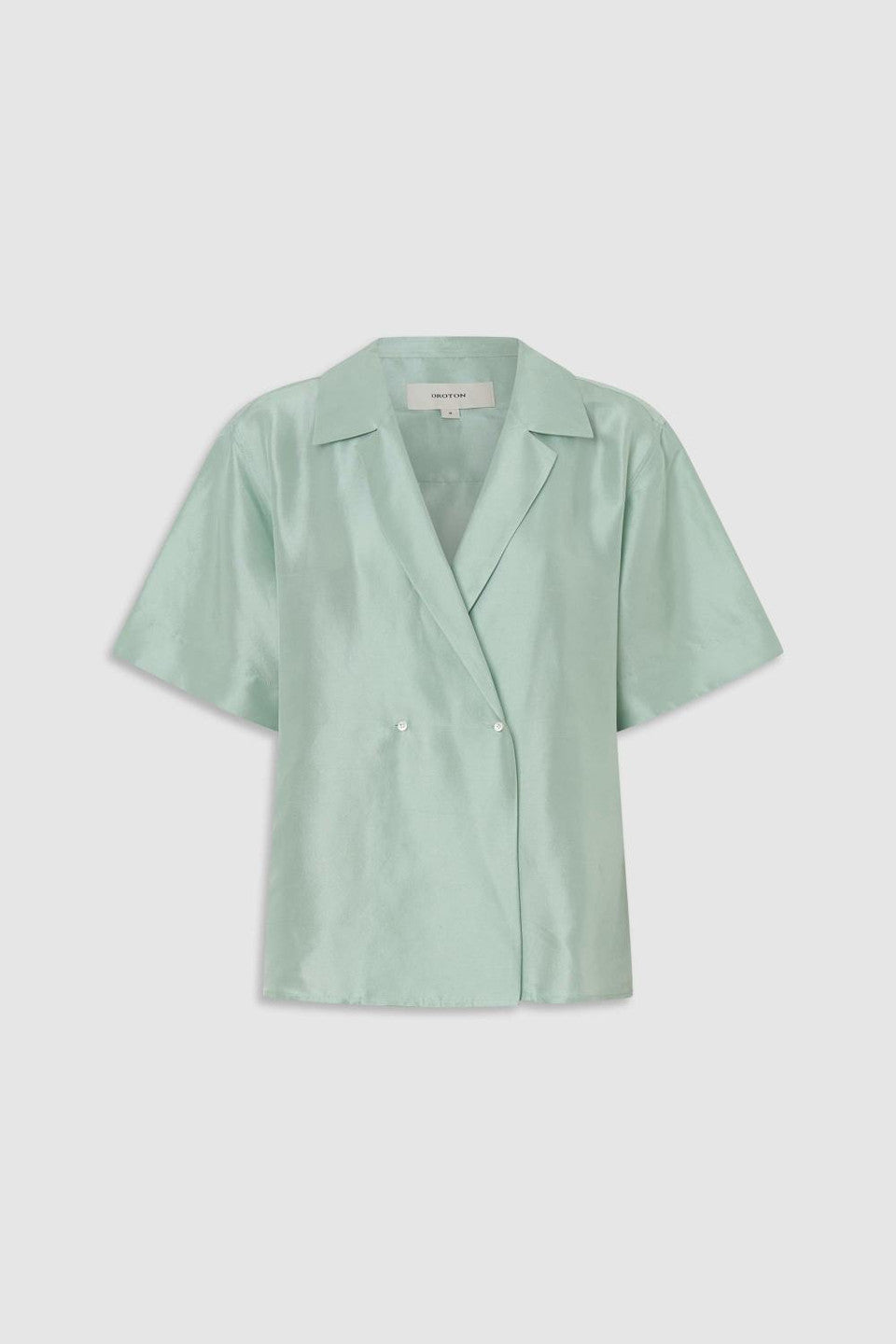 Wrap silk shirt in glass