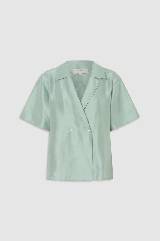 Wrap silk shirt in glass