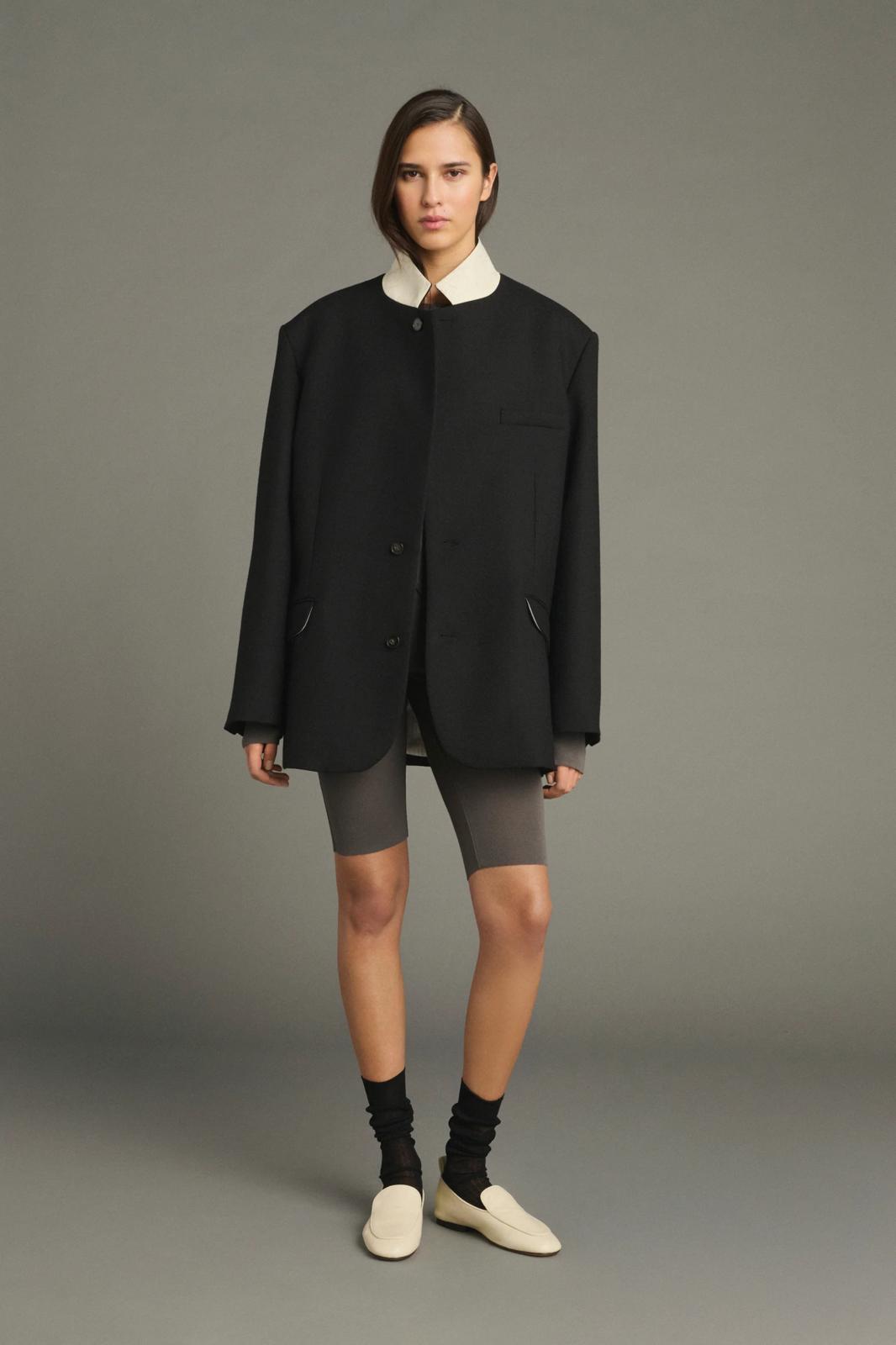 Lars coat                                   Oversized beige jacket with turned down collar