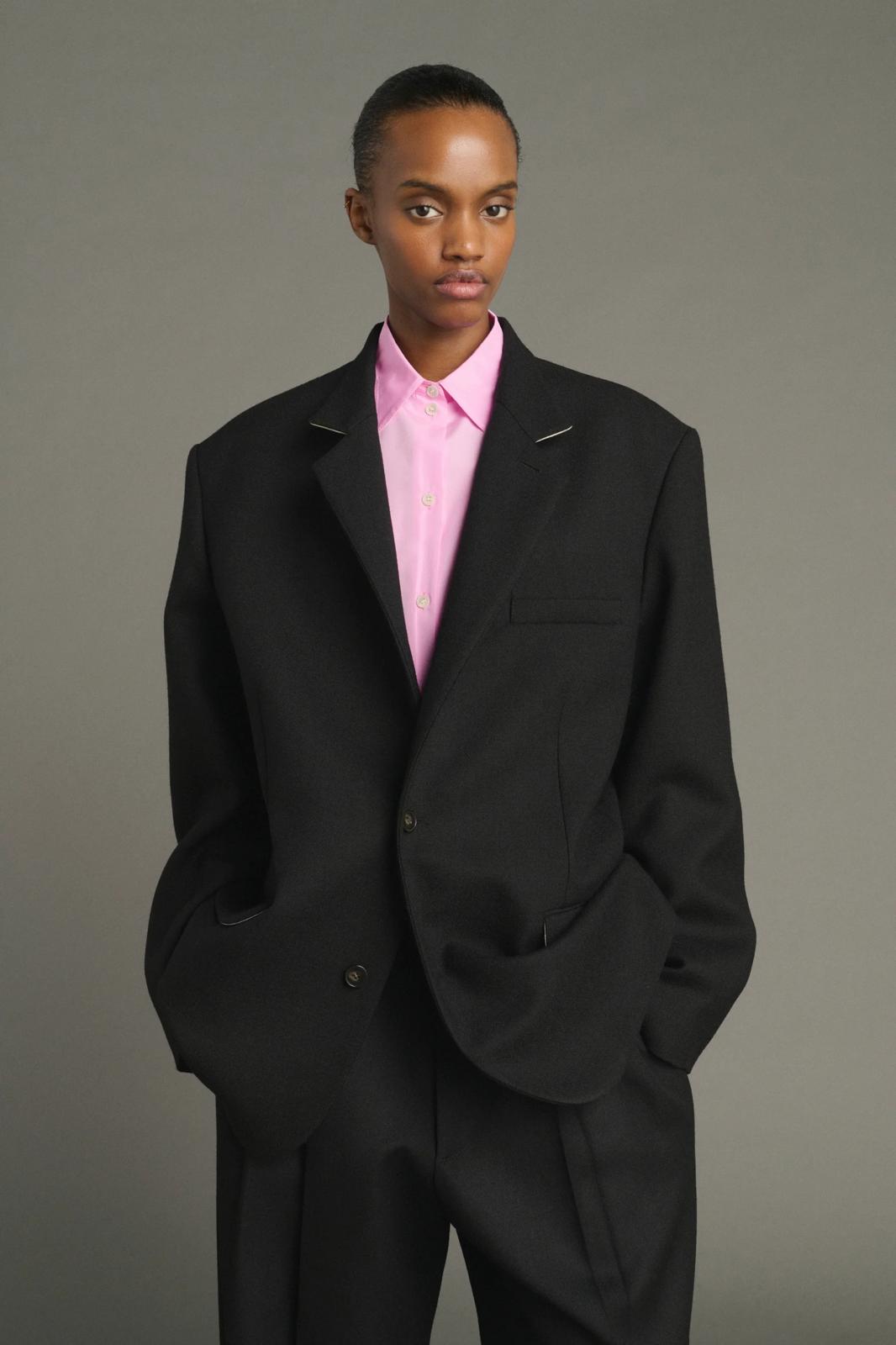 Lars coat                                   Oversized beige jacket with turned down collar